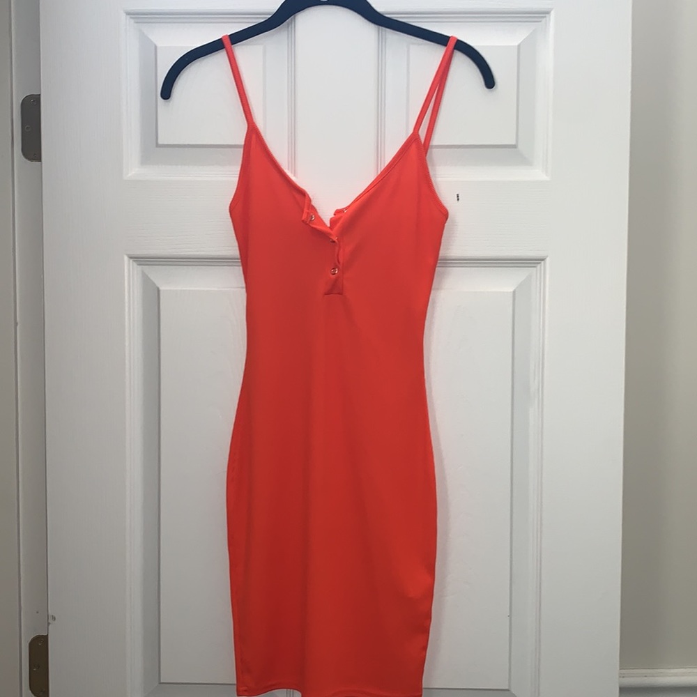 Orange pretty little thing dress. Ribbed detail.